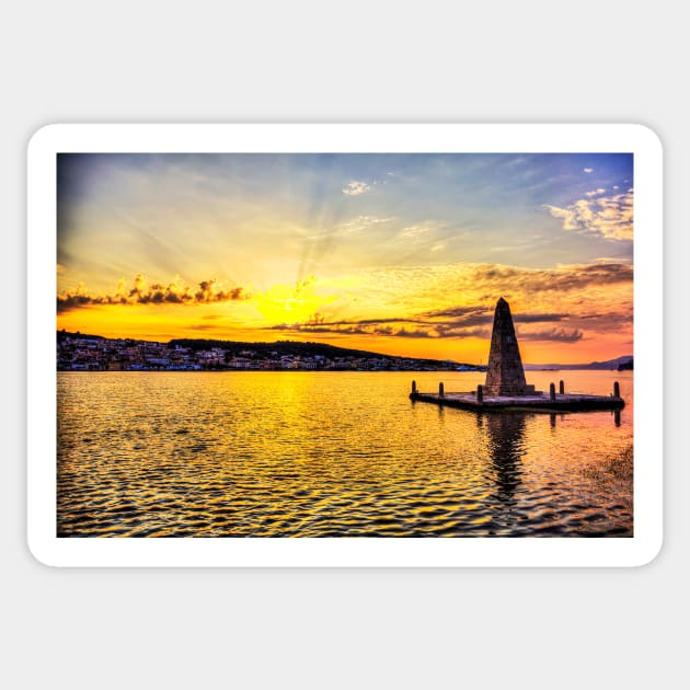 Obelisk at Drapano Bridge, and town of Argostoli behind, Kefalonia, Greece Sticker by tommysphotos